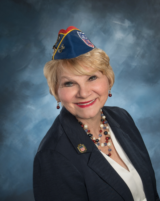 Smiling woman wearing patriotic veteran cap