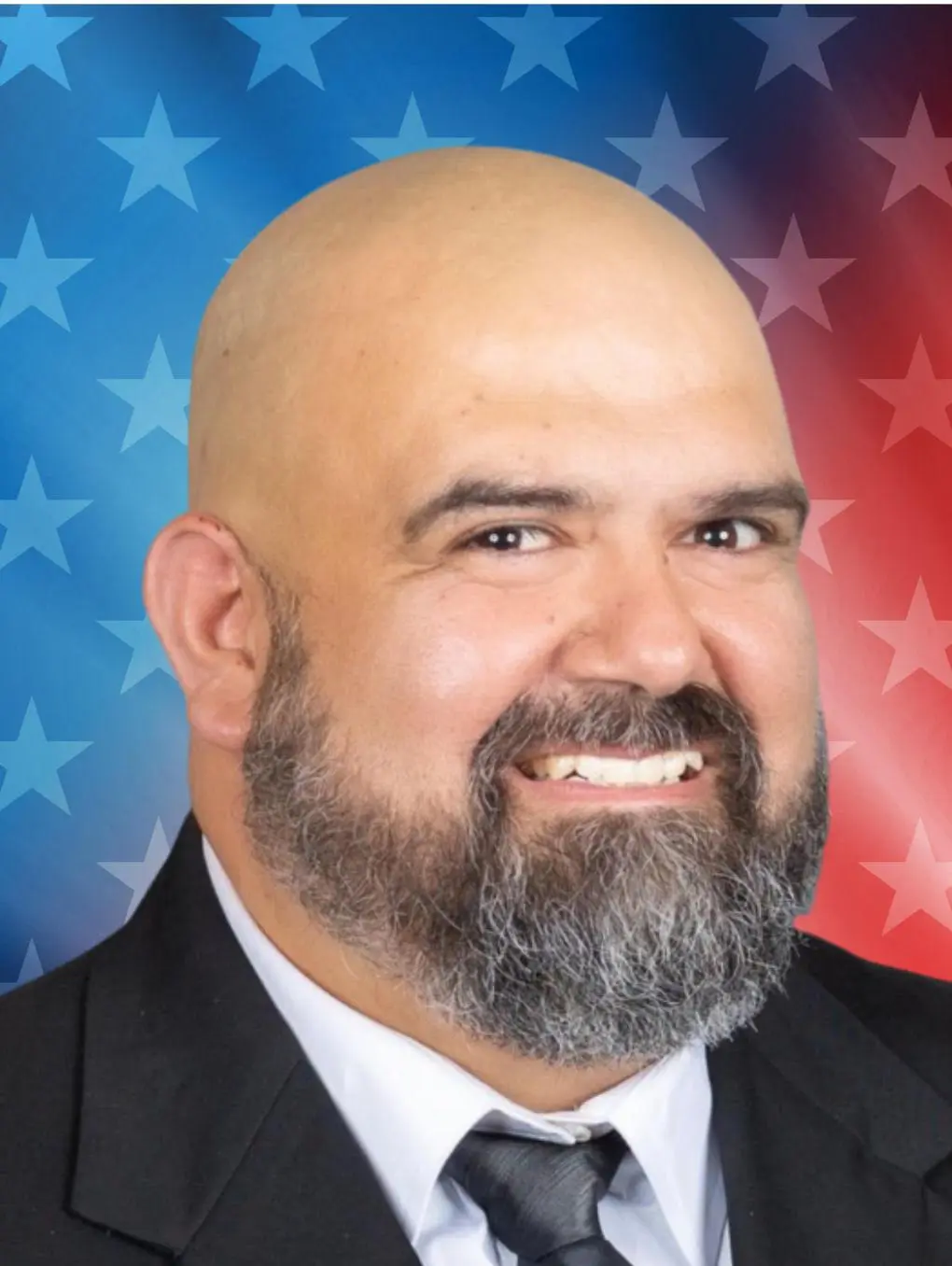 Smiling bald bearded man with star background