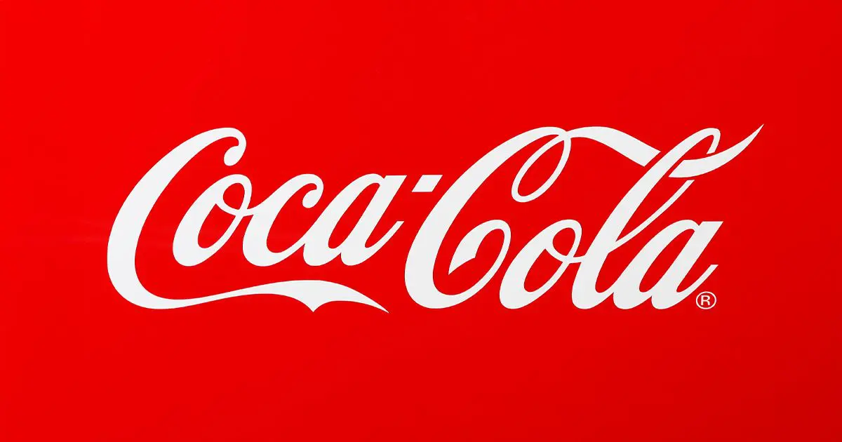 White Coca-Cola script logo on red background