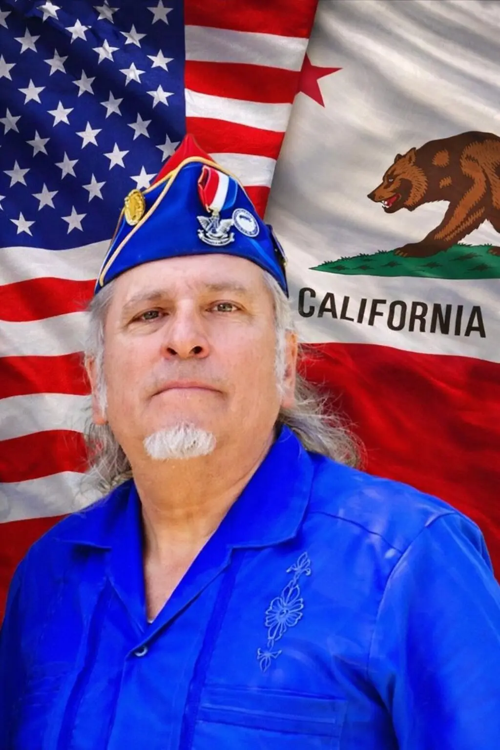 Veteran posing with American and California flags