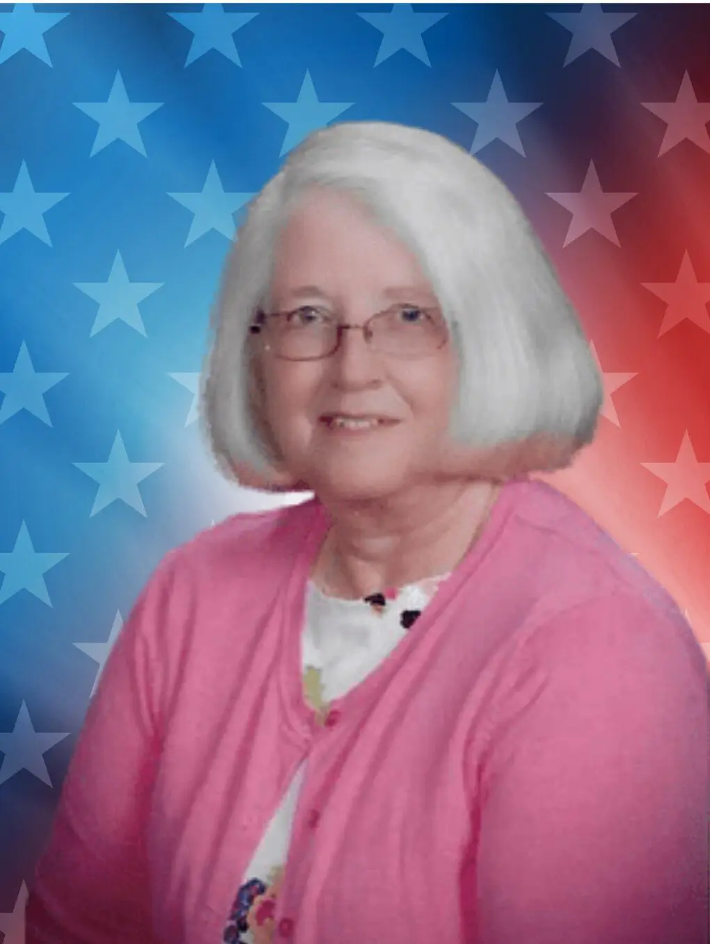 Older woman in pink sweater with American flag